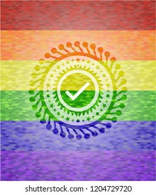 tick icon inside emblem on mosaic background with the colors of the LGBT flag