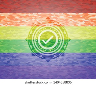 tick icon inside emblem on mosaic background with the colors of the LGBT flag