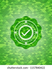 tick icon inside green emblem with mosaic ecological style background