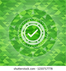 tick icon inside green emblem with mosaic background