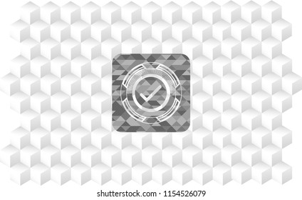 tick icon inside grey badge with geometric cube white background
