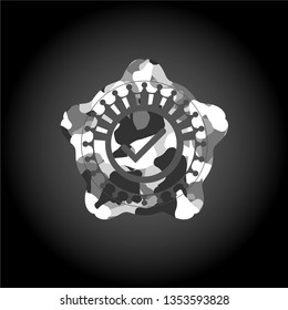 tick icon inside grey camouflage emblem