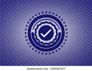 tick icon inside jean or denim emblem or badge background