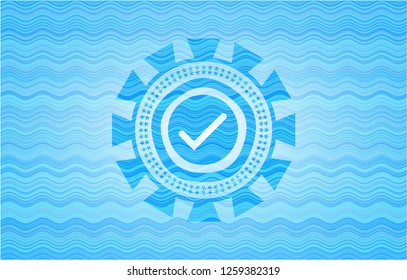 tick icon inside light blue water emblem.