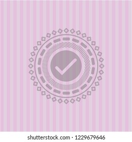 tick icon inside pink emblem