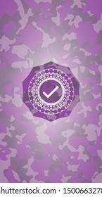 tick icon inside pink and purple camouflage texture