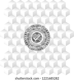 tick icon inside realistic grey emblem with geometric cube white background