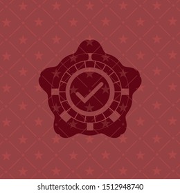 tick icon inside red emblem
