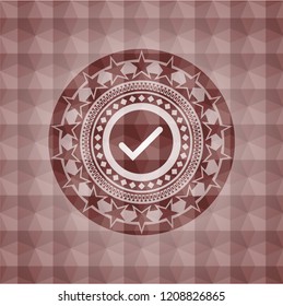 tick icon inside red seamless geometric emblem.