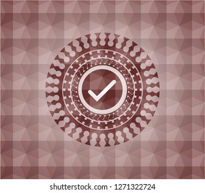 tick icon inside red seamless emblem with geometric pattern.