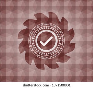 tick icon inside red seamless emblem or badge with abstract geometric pattern background.