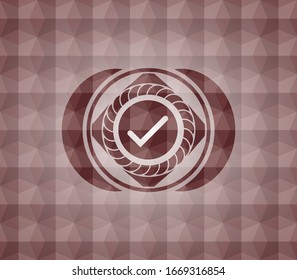 tick icon inside red seamless emblem with geometric pattern background.