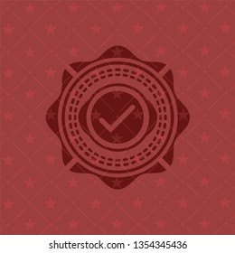tick icon inside retro red emblem