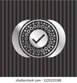 tick icon inside silver emblem