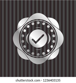 tick icon inside silver emblem