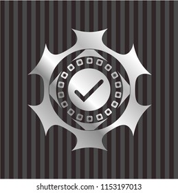 tick icon inside silvery shiny emblem