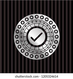 tick icon inside silvery shiny emblem