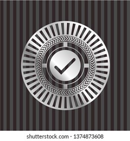 tick icon inside silvery shiny emblem