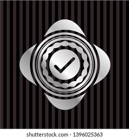 tick icon inside silvery shiny emblem