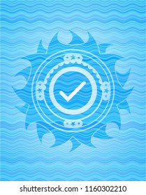 tick icon inside sky blue water emblem.