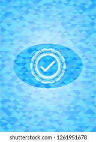 tick icon inside sky blue mosaic emblem