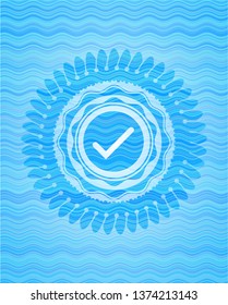 tick icon inside sky blue water emblem background.