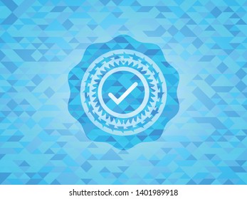 tick icon inside sky blue mosaic emblem