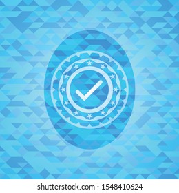 tick icon inside sky blue mosaic emblem