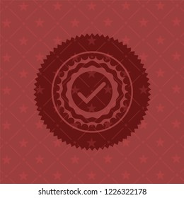 tick icon inside vintage red emblem
