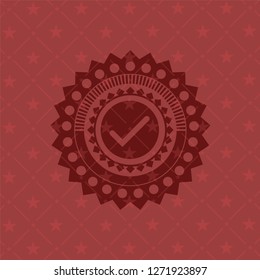 tick icon inside vintage red emblem