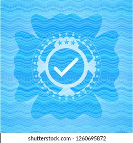 tick icon inside water representation badge.
