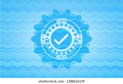 tick icon inside water wave representation emblem background.