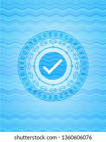 tick icon inside water wave badge background.