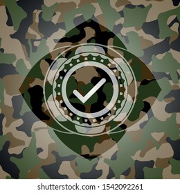 tick icon on camouflaged pattern