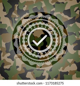 tick icon on camouflaged texture