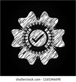 tick icon on chalkboard