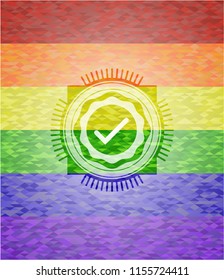 tick icon on mosaic background with the colors of the LGBT flag