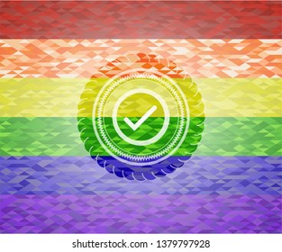 tick icon on mosaic background with the colors of the LGBT flag