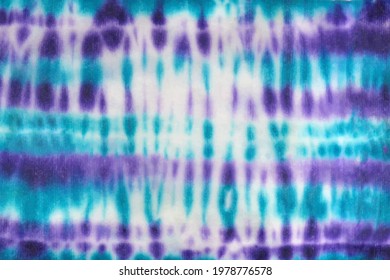 Tie dye shibori pattern. Hand painted ornamental purple blue teal turquoise elements on white background. Abstract texture. Print for textile, fabric, wallpaper, wrapping paper.