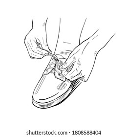 
Tie the laces on the sneakers with your hands. Drawing of hands knitting a bow on shoes. Shod foot