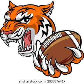 A tiger American Football player cartoon animal sports mascot holding a ball in its claw