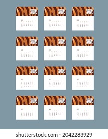 Tiger calendar design concept, cute tiger, new year character. 12 months. The symbol of the tiger of the New Year 2022. Vector illustration of a tiger portrait.