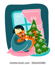 The tiger and the child are hugging next to the Christmas tree by the window. Festive mood. Flat vector illustration.