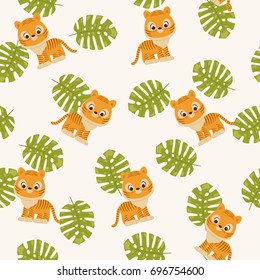 Tiger cub and tropical leaves. Seamless vector pattern/wallpaper. Fabric design for boys. 