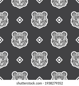 Tiger face seamless pattern in Maori style. Boho tiger face. Good for backgrounds, prints, apparel and textiles. Vector