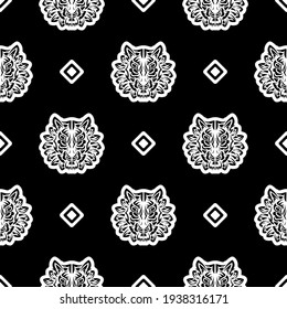 Tiger face seamless pattern in samoan style. Boho tiger face. Good for backgrounds, prints, apparel and textiles. Vector illustration.