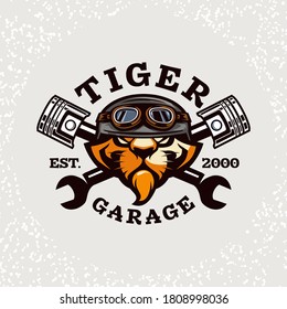 Tiger head auto repair and custom garage logo. Design element for company logo, label, emblem, sign, apparel or other merchandise. Scalable and editable Vector illustration.