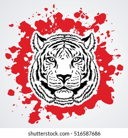 Tiger head designed on splash blood graphic vector.
