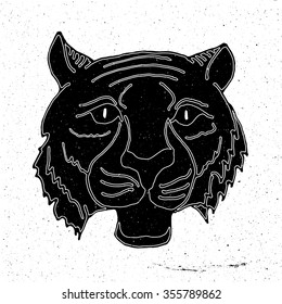Tiger head hand drawn in grunge style, can be used as t-shirt print, textile, background, sign for the zoo and the circus, logo, tattoo, poster