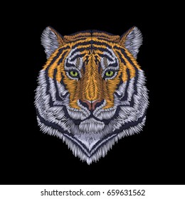 Tiger head noble staring. Front view embroidery patch sticker. Orange striped black wild animal stitch texture textile print. Jungle logo vector illustration art